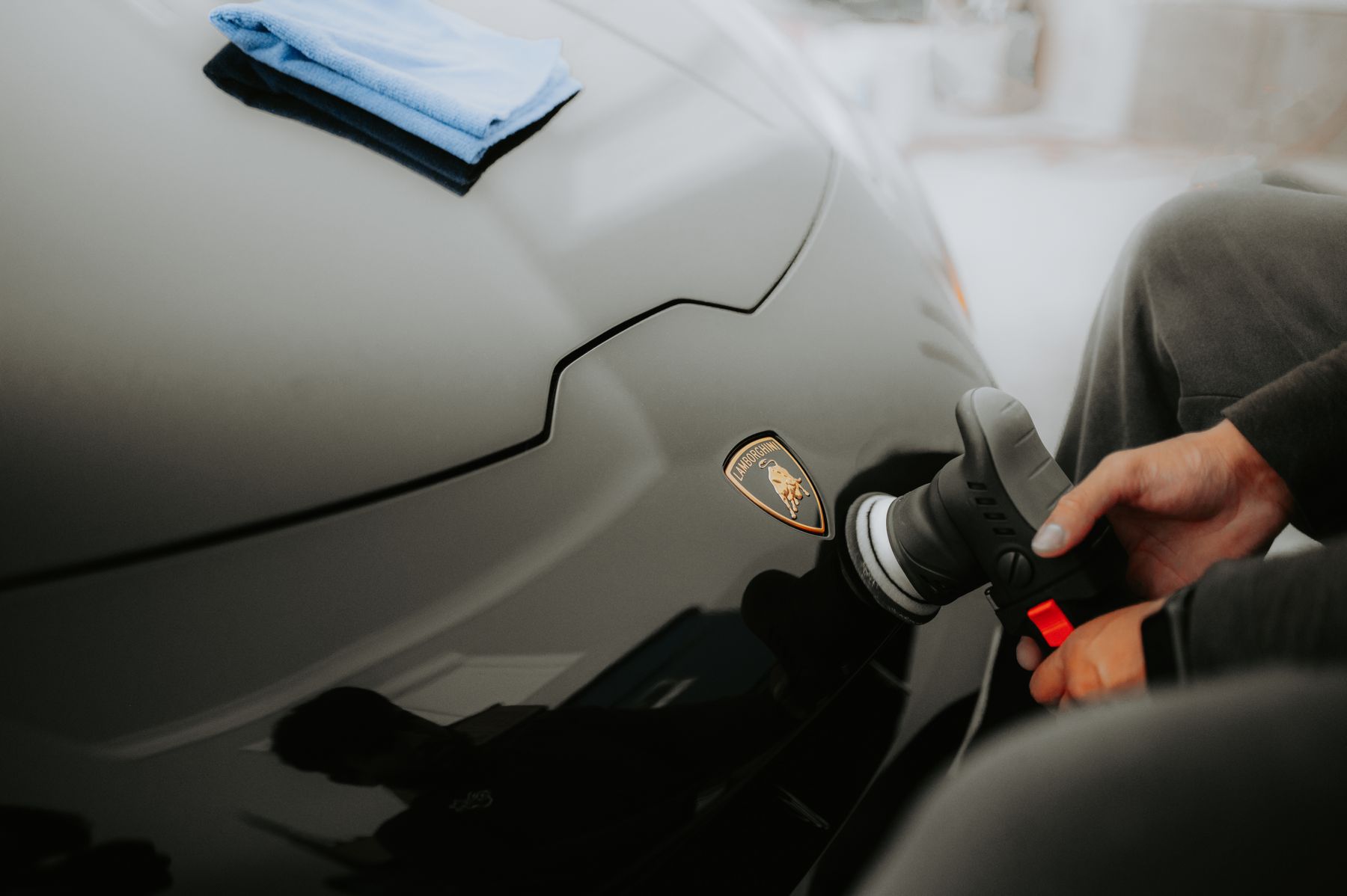 Polishing the bodywork of a black car